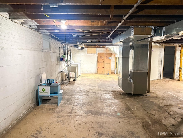 basement featuring heating unit