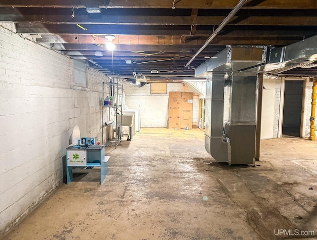 657 Lake Ave, Ironwood, MI 49938 - unfinished basement with heating unit