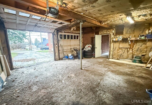 657 Lake Ave, Ironwood, MI 49938 - garage featuring a garage door opener