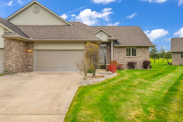 ranch-style house featuring a front lawn and a garage