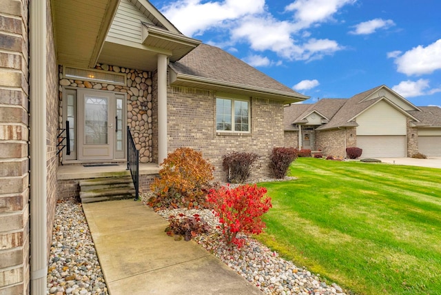 doorway to property featuring a yard