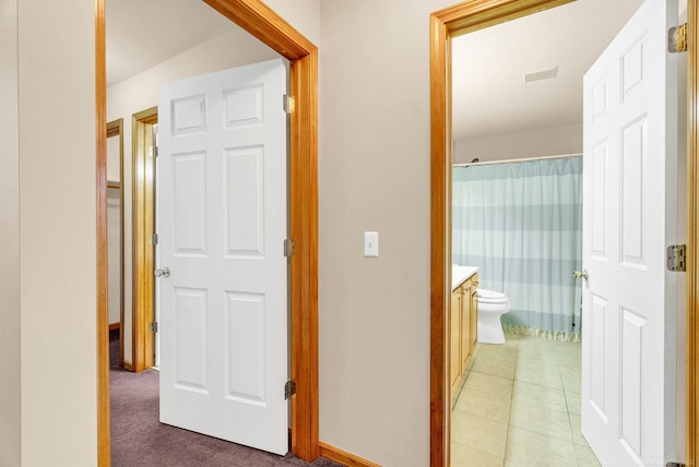 corridor featuring tile patterned floors