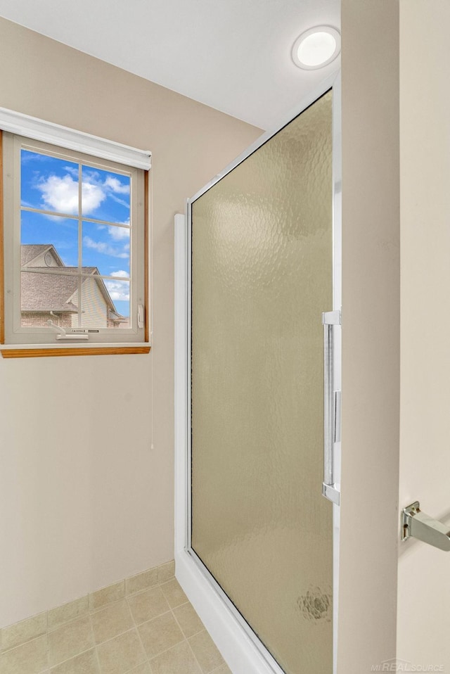 bathroom with a shower with shower door