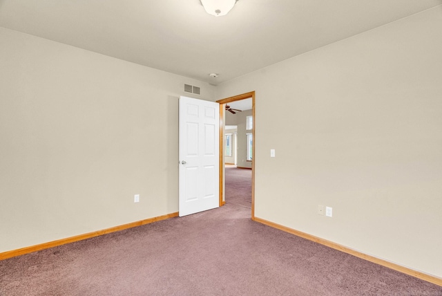 empty room with carpet flooring