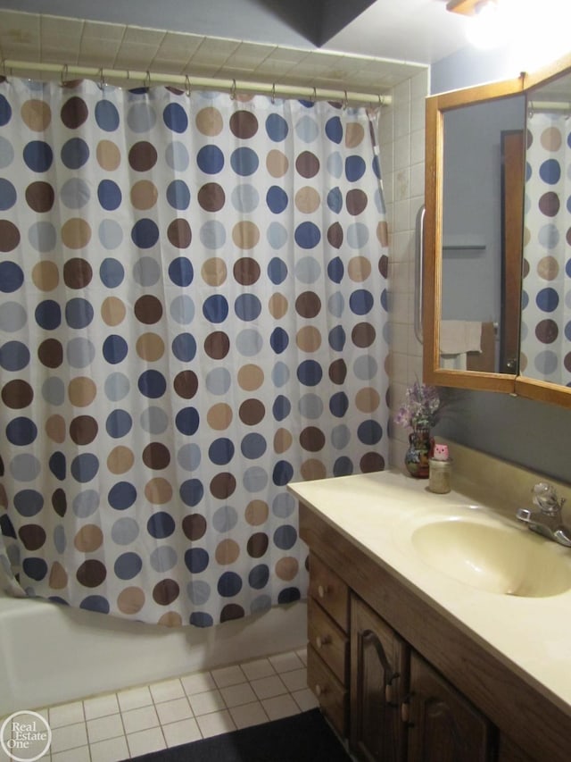 bathroom featuring shower / bath combo, vanity, and tile patterned floors