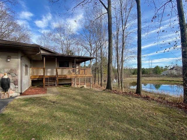 view of yard featuring a deck with water view