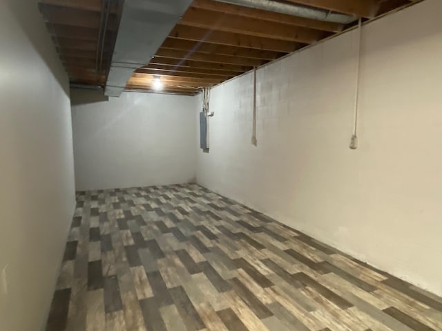 basement featuring wood-type flooring