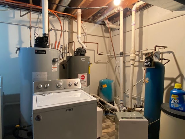 utilities featuring water heater, gas water heater, and washer / dryer