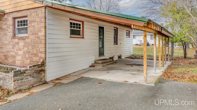 exterior space with a carport