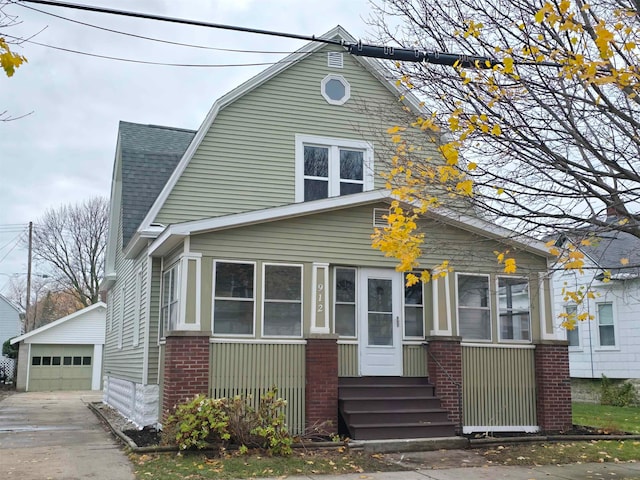 view of front facade with an outbuilding and a garage