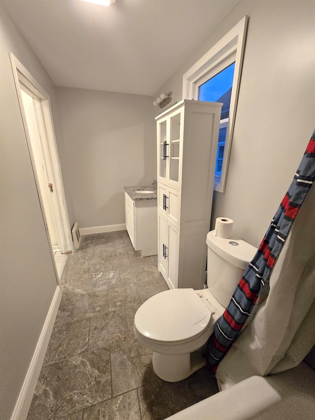 bathroom with vanity and toilet