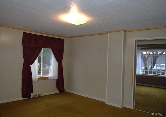 carpeted empty room with ornamental molding