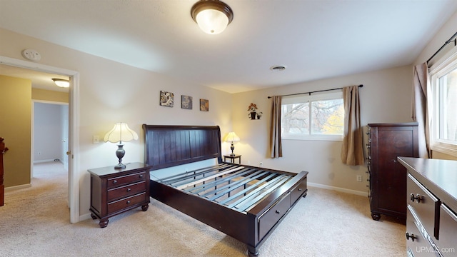 bedroom featuring light colored carpet