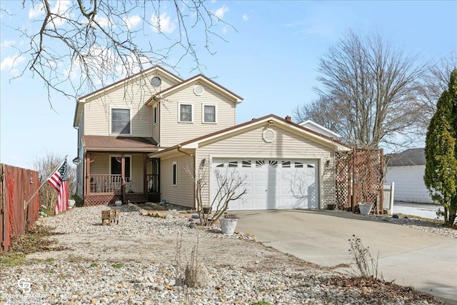 view of front property with covered porch and a garage