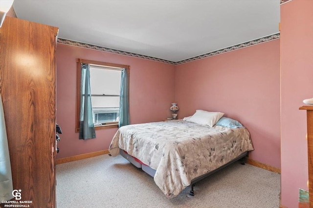 bedroom featuring light carpet