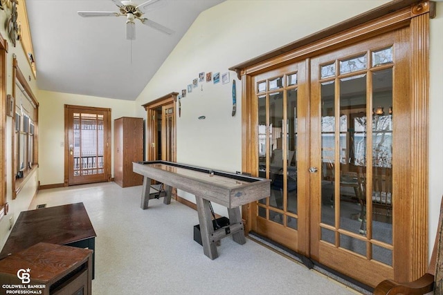 playroom featuring ceiling fan, french doors, and lofted ceiling