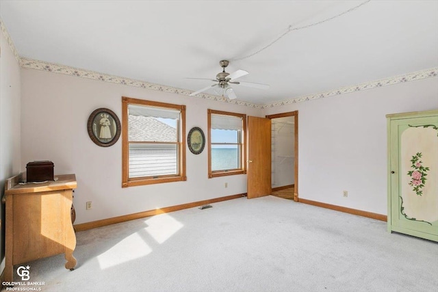 unfurnished bedroom with light carpet