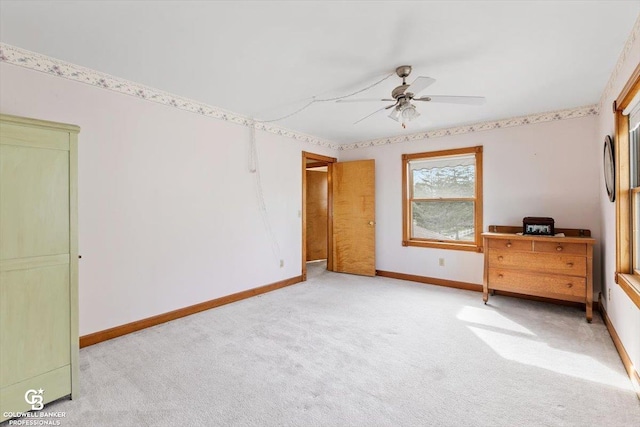 unfurnished bedroom with light colored carpet and ceiling fan