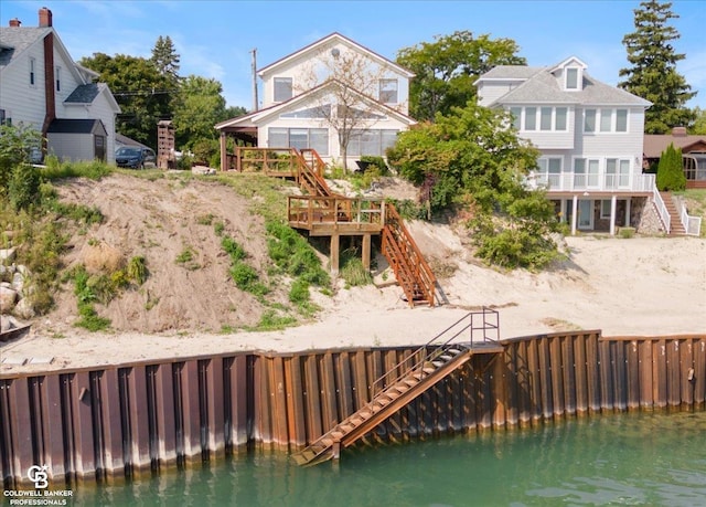 back of house featuring a water view