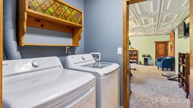 washroom featuring carpet and washing machine and dryer