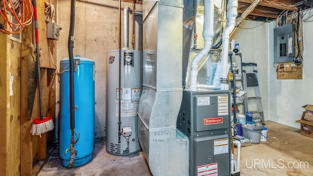 utility room featuring gas water heater, electric panel, and heating unit