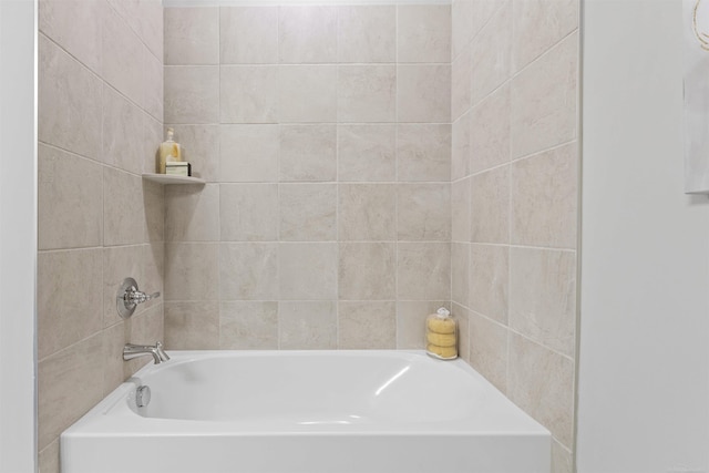 bathroom with a tub