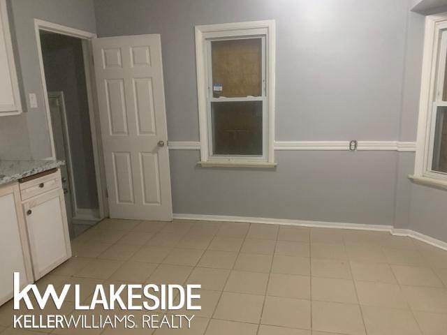 bathroom with tile patterned floors