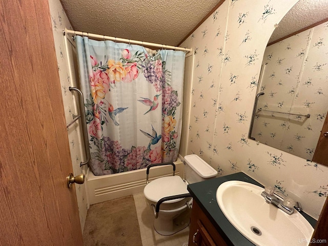 full bathroom featuring shower / bath combo with shower curtain, vanity, a textured ceiling, and toilet