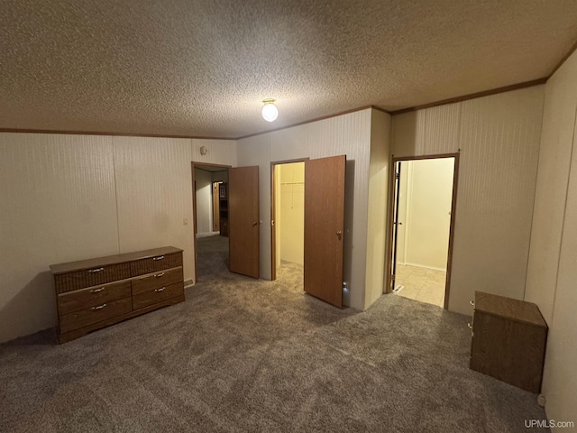 unfurnished bedroom featuring dark carpet and crown molding