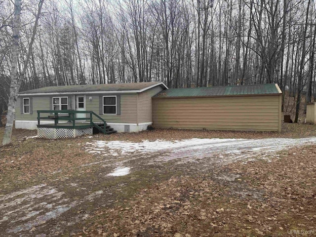 view of front of house with a wooden deck