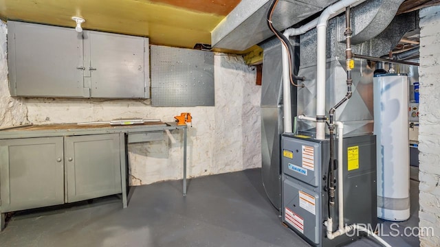 utility room with gas water heater and heating unit