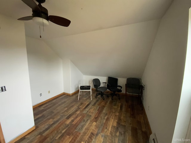 interior space with ceiling fan, dark hardwood / wood-style flooring, and lofted ceiling