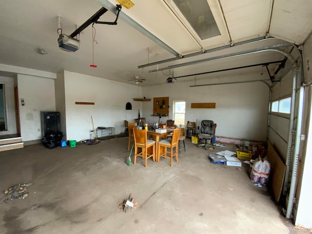 garage featuring ceiling fan and a garage door opener