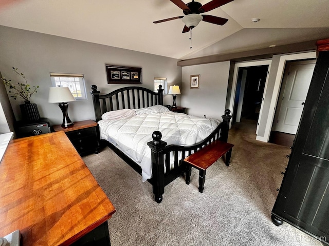 carpeted bedroom with ceiling fan and vaulted ceiling