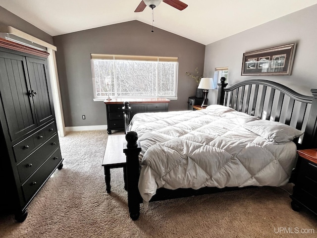 bedroom with ceiling fan, light colored carpet, and lofted ceiling