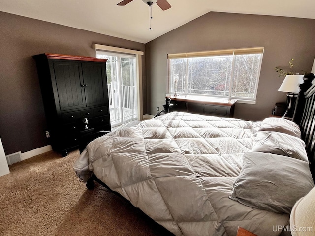 carpeted bedroom featuring access to exterior, vaulted ceiling, and ceiling fan