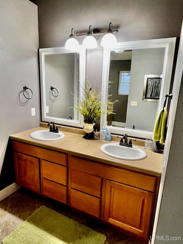 bathroom featuring tile patterned flooring and vanity