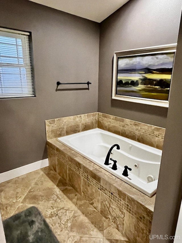 bathroom with tiled bath