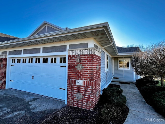 view of property exterior featuring a garage