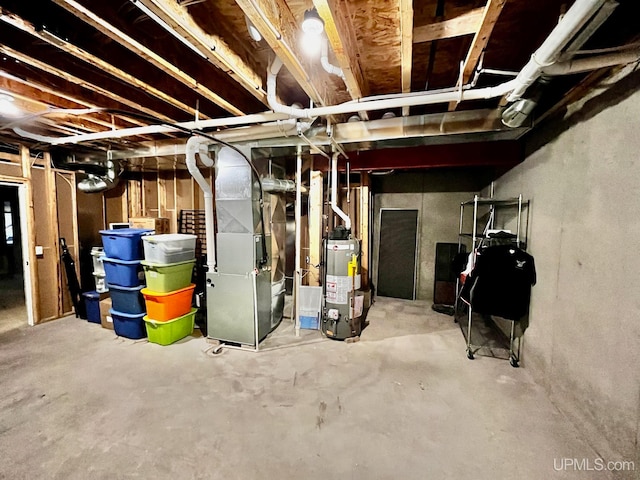 basement with gas water heater and heating unit