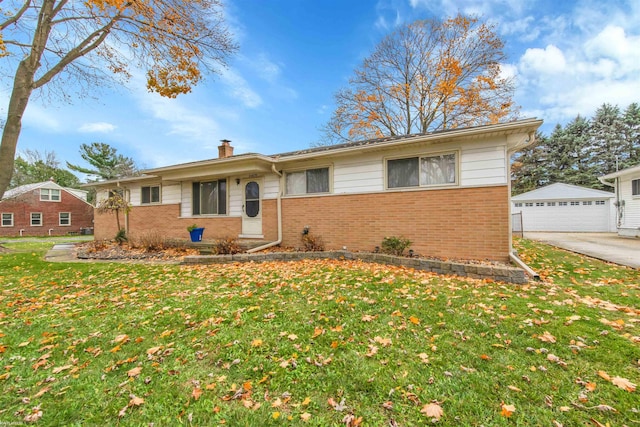 single story home featuring a garage, an outdoor structure, and a front lawn