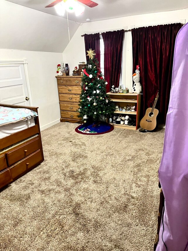 bedroom featuring lofted ceiling, carpet flooring, and ceiling fan