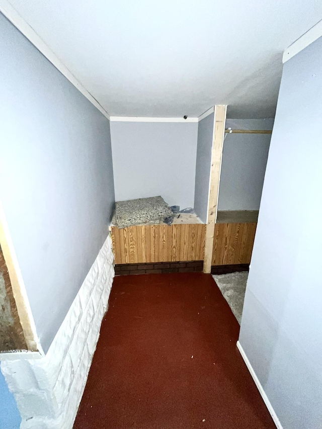 unfurnished bedroom featuring crown molding