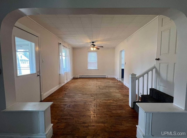 foyer featuring ceiling fan, crown molding, a baseboard radiator, and hardwood / wood-style flooring