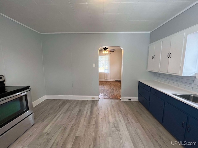 kitchen with white cabinetry, sink, backsplash, stainless steel electric stove, and light wood-type flooring