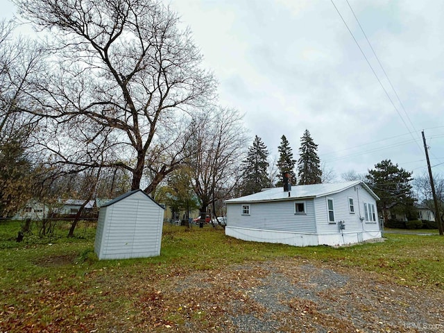 exterior space with a storage shed