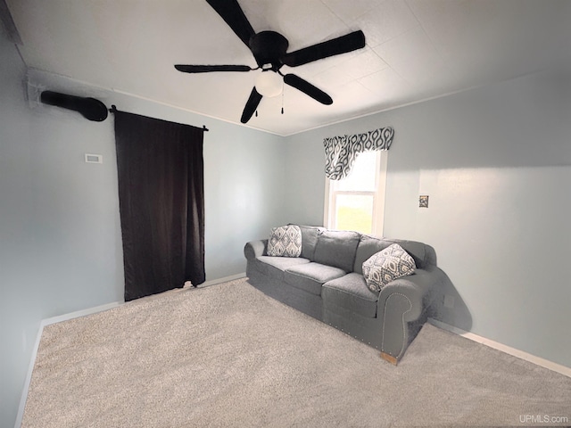 carpeted living room with ceiling fan