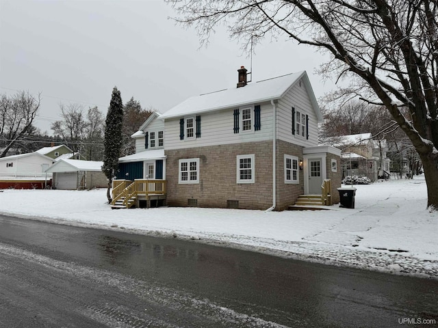 view of front of house with an outdoor structure and a garage