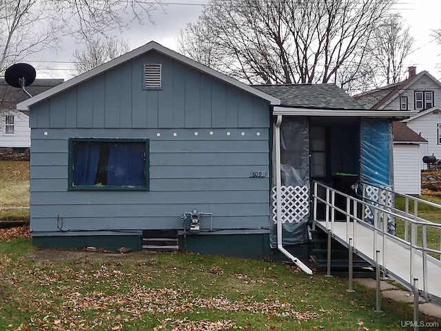 view of home's exterior with a lawn