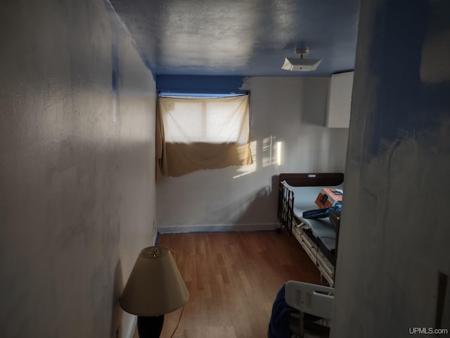 bedroom with hardwood / wood-style floors